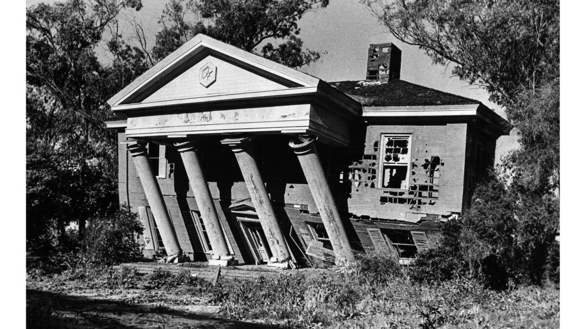Feb. 21, 1978: A push from a tractor knocks down mansion at old MGM lot 2.