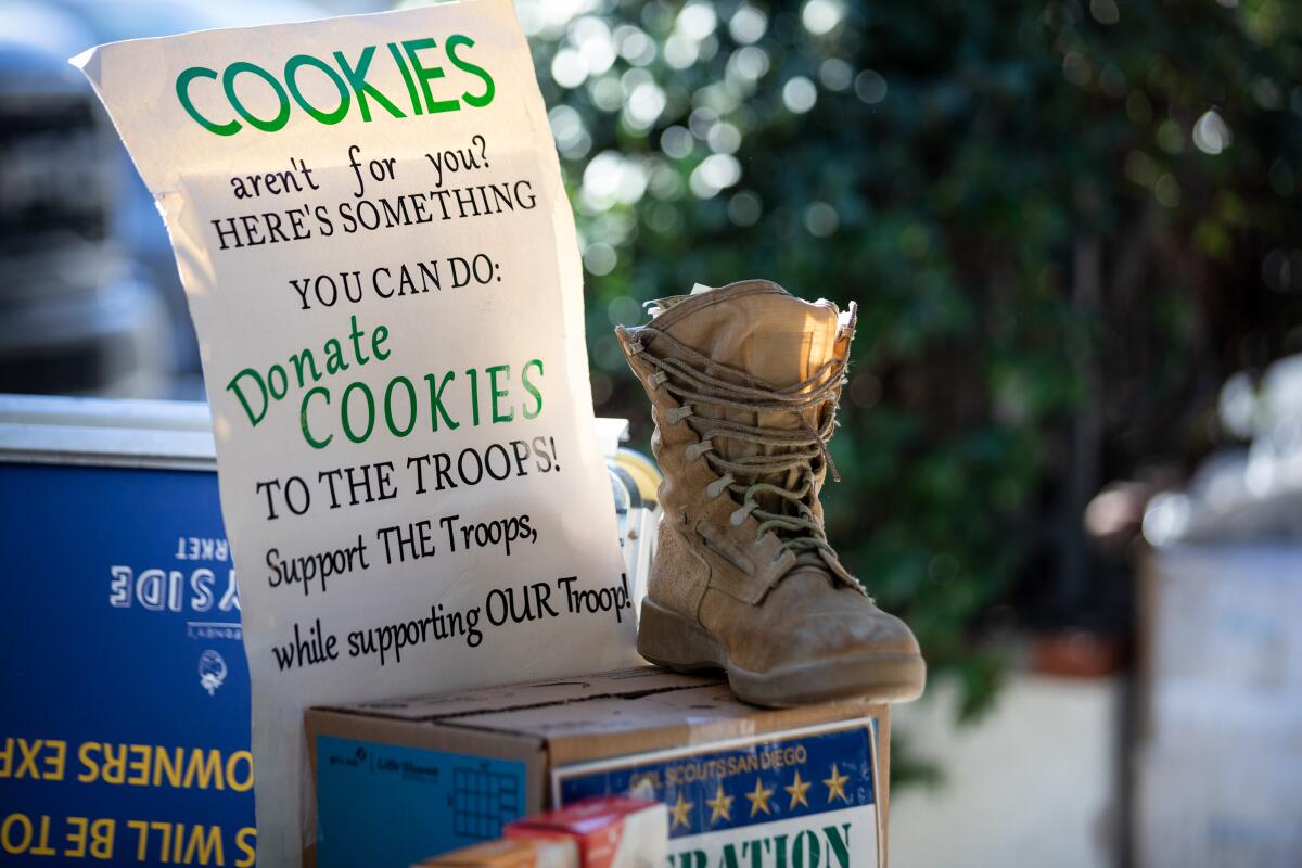 A Girl Scout donation box for troops outside Boney’s Bayside Market at Coronado on Friday, Feb. 11, 2022.
