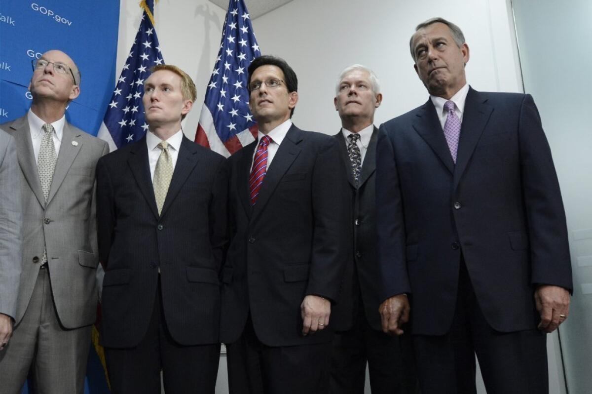 House Speaker John Boehner (R-Ohio) attends a news conference on Friday with his GOP colleagues, from left, Greg Walden, James Lankford, House Majority Leader Eric Cantor and Pete Sessions.