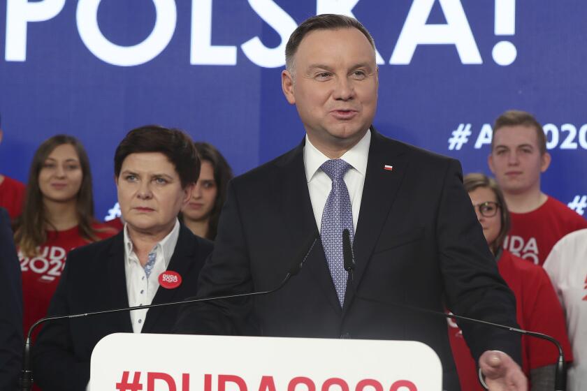 FILE - In this Feb. 19, 2020 file photo, Poland's President Andrzej Duda campaigns for his re-election in Warsaw, Poland. Poland's parliament speaker says the postponed presidential election will take place June 28. The election was originally planned for May 10 but the coronavirus pandemic forced the conservative government to put it off. (AP Photo/Czarek Sokolowski, File)