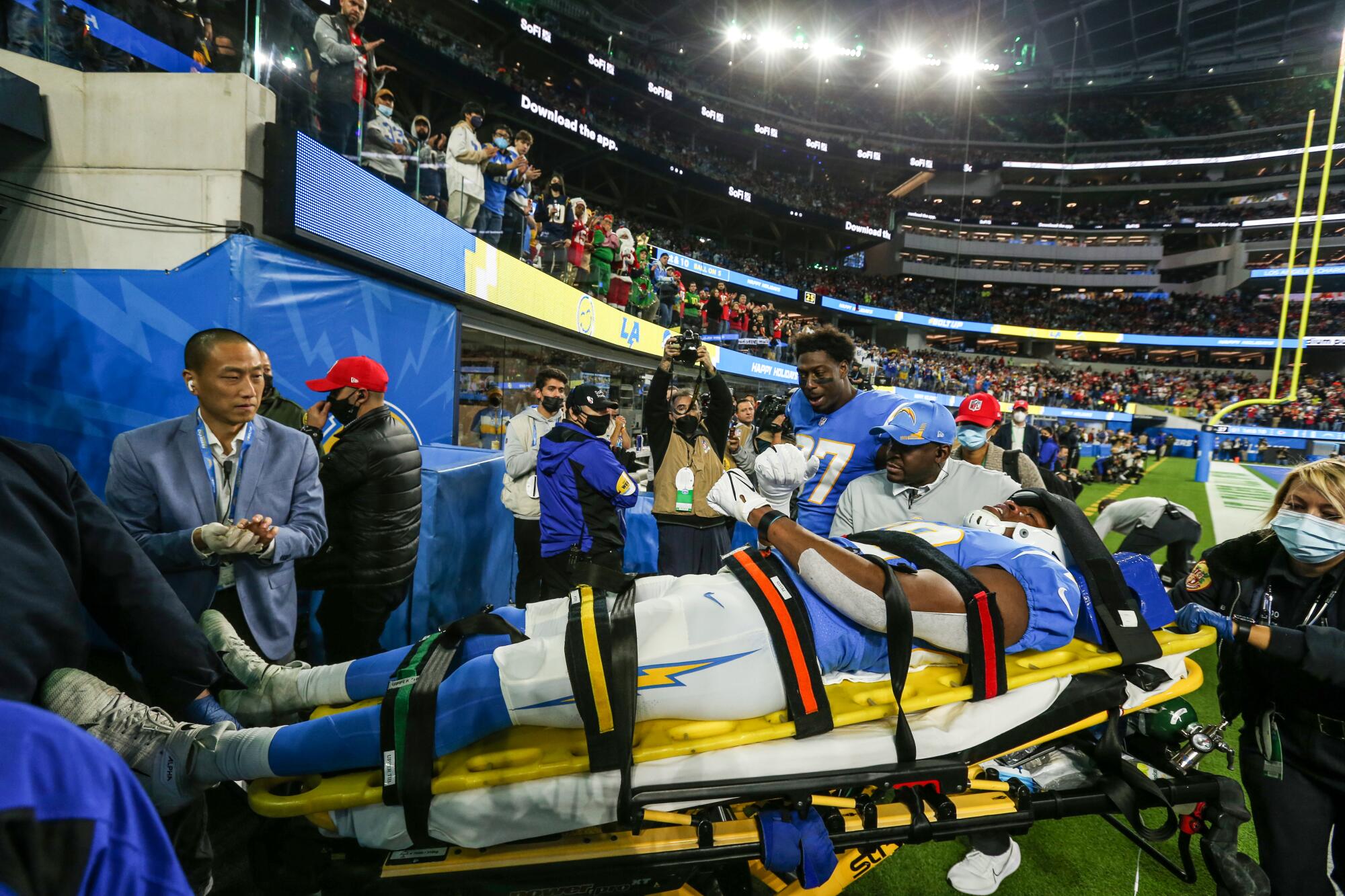 Chargers tight end Donald Parham is stretchered off the field after being knocked unconscious.