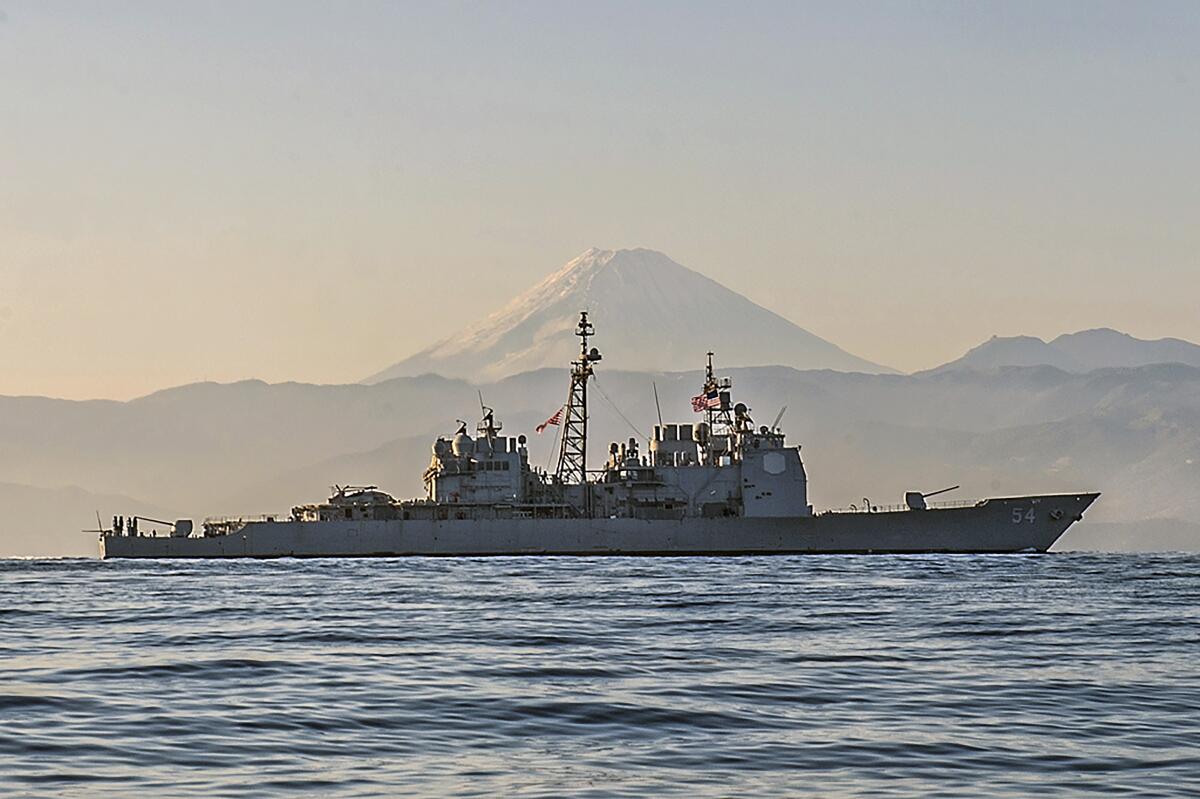 Ticonderoga-class guided-missile cruiser USS Antietam (CG 54) is underway off the coast of Japan near Mt. Fuji. Antietam is on patrol in the 7th Fleet area of operations in support of security and stability in the Indo-Asia-Pacific region, Nov. 22, 2014. The U.S. Navy is sailing the USS Antietam and the USS Chancellorsville warships through the Taiwan Strait Sunday, in the first such transit publicized since US House Speaker Nancy Pelosi visited Taiwan earlier in August, at a time where tensions have kept the waterway particularly busy. (Mass Communication Specialist Seaman David Flewellyn/U.S. Navy via AP)