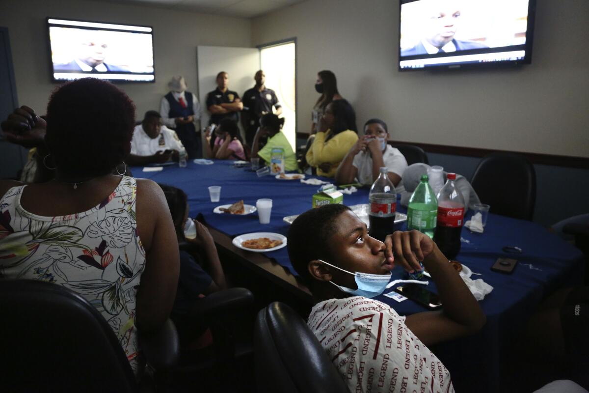 Malachi Keller watches a police promotional video