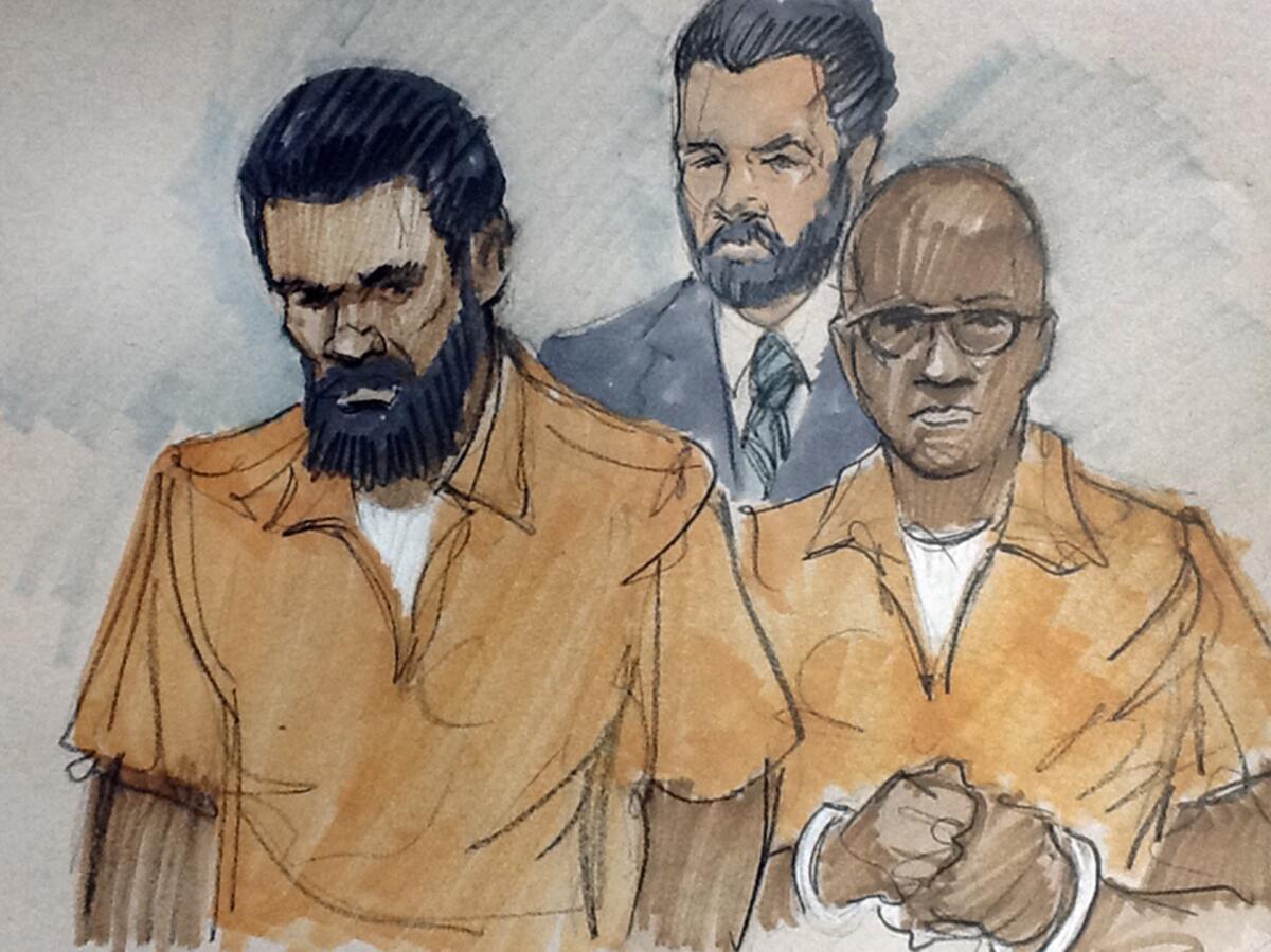 In this courtroom sketch, Jonas Edmonds, left, and Hasan Edmonds, right, stand in front of an FBI agent at a hearing in federal court in Chicago.