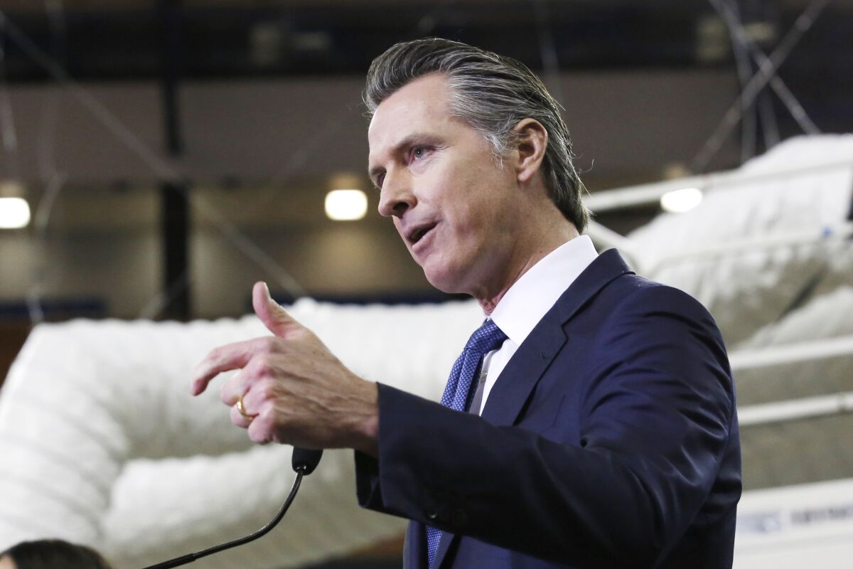 Gov. Gavin Newsom discusses the transformation of Sleep Train Arena for use as a field hospital in Sacramento on April 6.