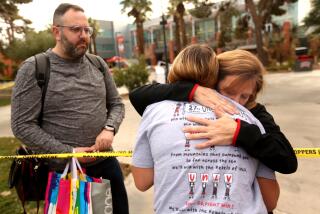 LAS VEGAS, NV - DECEMBER 7, 2023 - A UNLV student is hugged by a campus worker, right, at the scene where three people died and one person was injured in a mass shooting at the UNLV campus. Photo taken on December 7, 2023. (Genaro Molina / Los Angeles Times) union