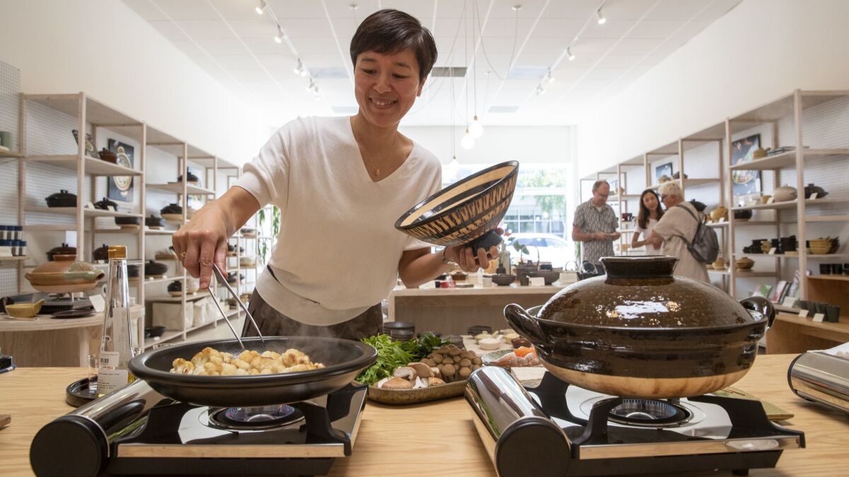 Naoko Takei Moore, owner of Toiro, cooks lunch for her staff. Moore gave private donabe cooking lessons before opening the store in 2017.