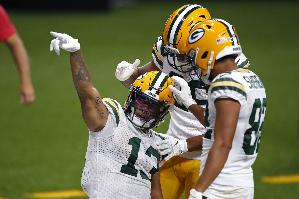 Green Bay Packers wide receiver Allen Lazard (13) reacts after a 72 year pass completion setting up a touchdown in the second half of an NFL football game against the New Orleans Saints in New Orleans, Sunday, Sept. 27, 2020. (AP Photo/Butch Dill)