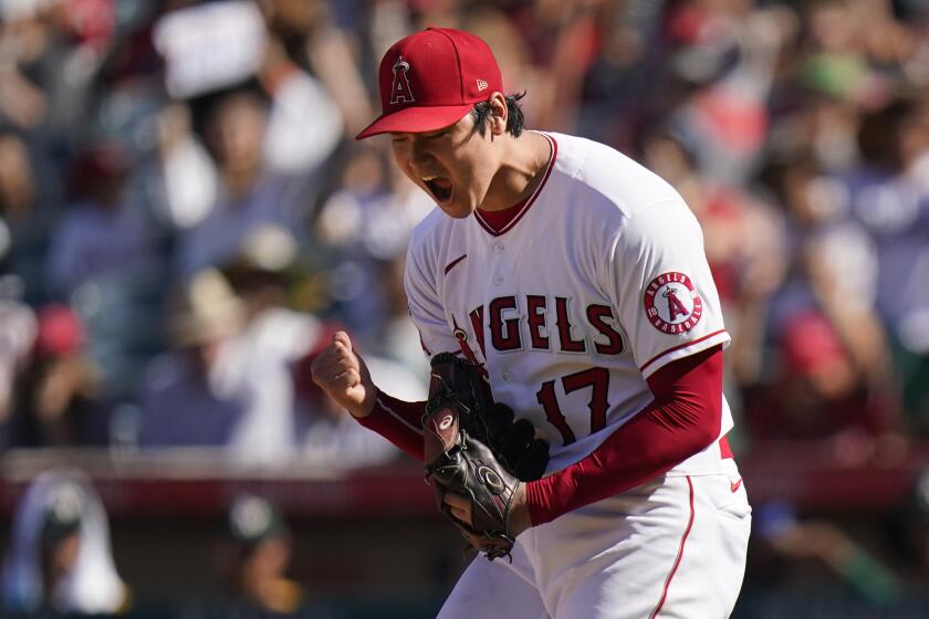 Los Angeles Angels starting pitcher Shohei Ohtani, of Japan, reacts after striking out Oakland Athletics' Matt Chapman.