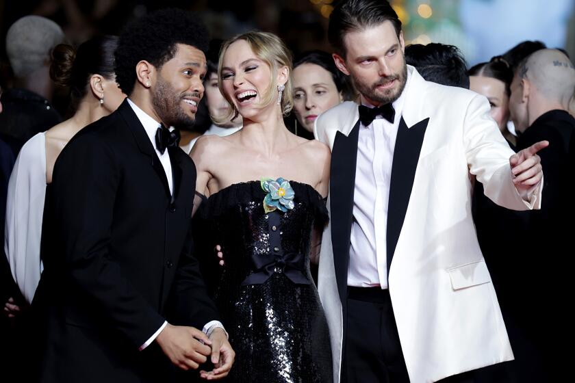 CANNES, FRANCE - MAY 22: (L-R) Abel “The Weeknd” Tesfaye, Lily-Rose Depp and Sam Levinson attend the "The Idol" red carpet during the 76th annual Cannes film festival at Palais des Festivals on May 22, 2023 in Cannes, France. (Photo by Pascal Le Segretain/Getty Images)