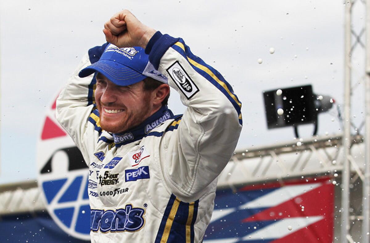 Brian Vickers celebrates in Victory Lane after winning the NASCAR Sprint Cup Series race at New Hampshire Motor Speedway on Sunday.