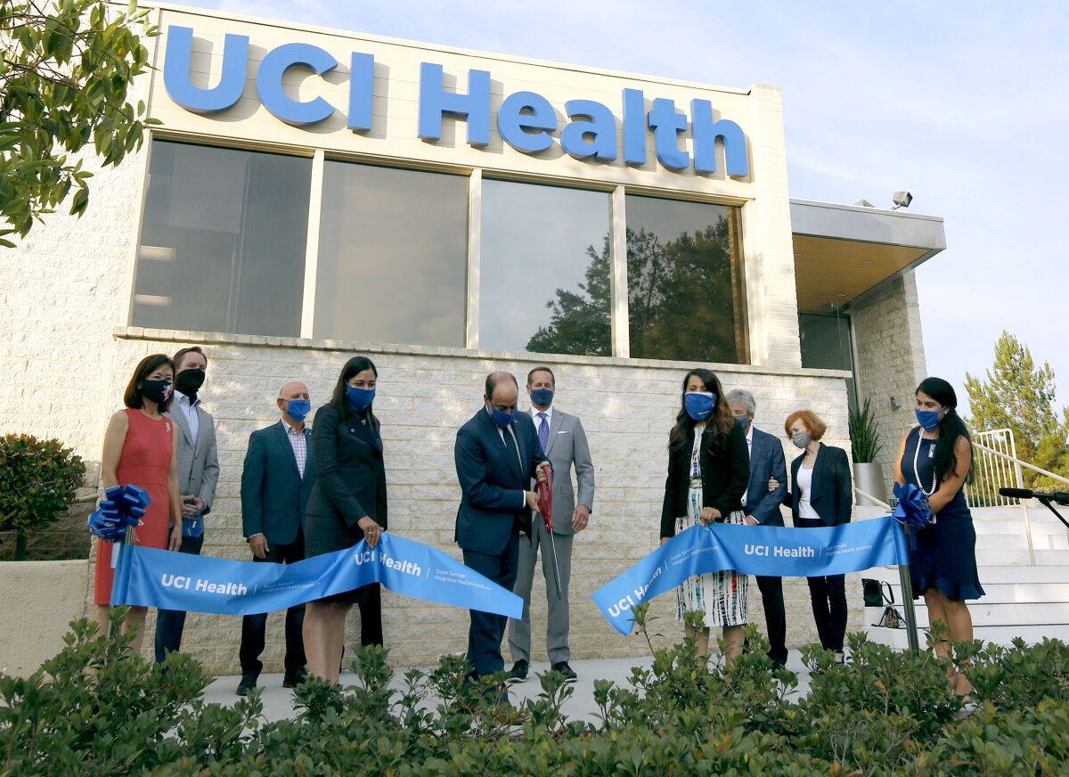 UCI Health CEO Chad Lefteris cuts the ribbon.