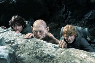 Photo from 'Lord of the Rings' show Andy Serkis' Gollum in between Elijah Woods' Frodo and Sean Astin's Sam on a cliff