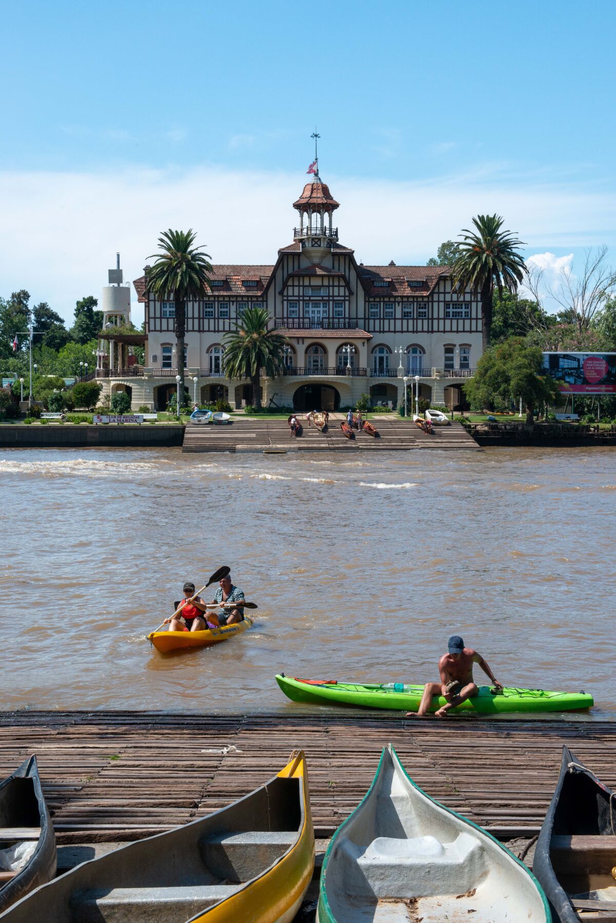 Visitors float in kayaks in front of the Club de Regatas La Marina in Tigre.