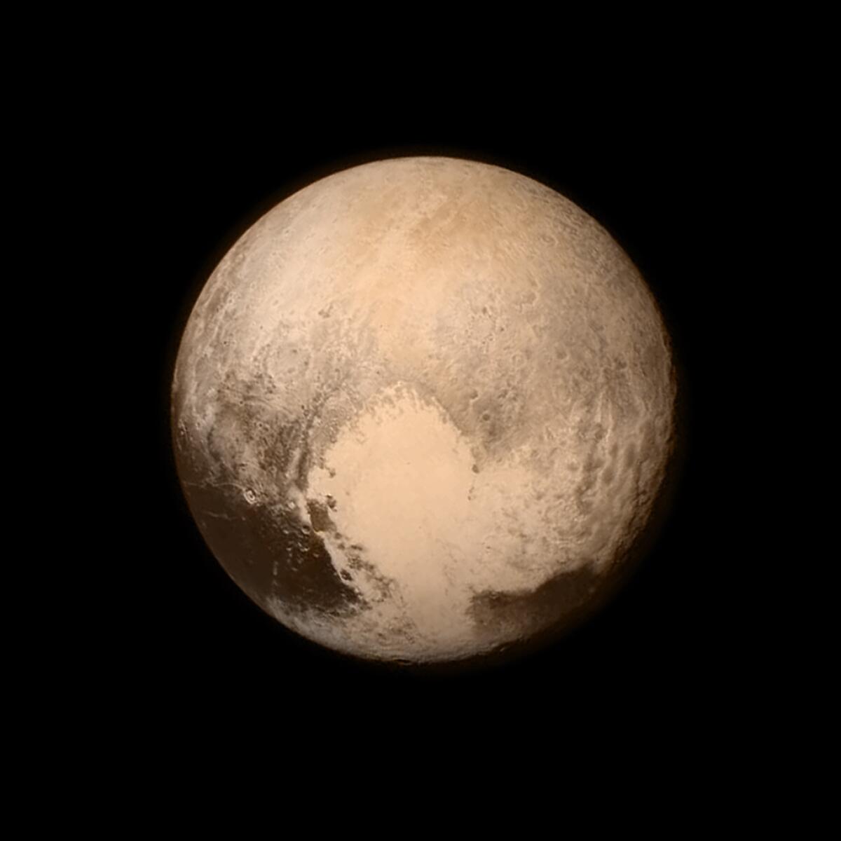 Pluto's "heart" is shown in an image from NASA's New Horizons spacecraft, taken on July 13 when the spacecraft was 476,000 miles from the surface.