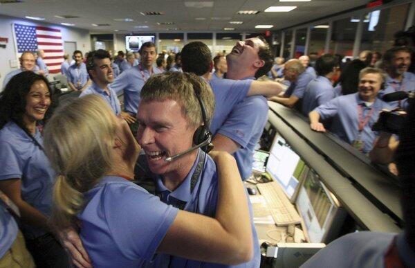 Curiosity survives the dreaded "Seven Minutes of Terror" and lands successfully on Mars. Staffers at the Jet Propulsion Laboratory in La Canada Flintridge (and people around the world) celebrate.