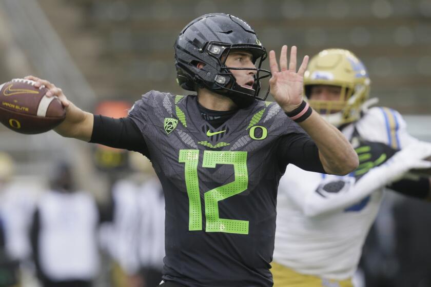 Oregon's Tyler Shough throws downfield against UCLA during the third quarter.