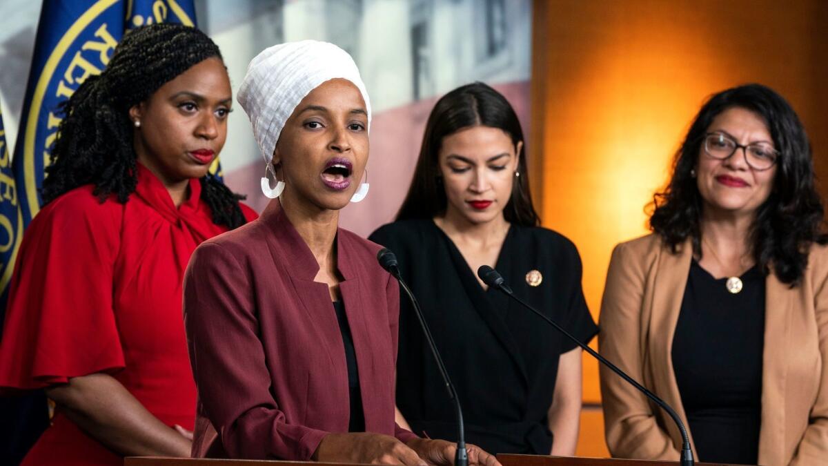 Democratic congresswomen, from left, Ayanna Pressley, Ilhan Omar, Alexandria Ocasio-Cortez, and Rashida Tlaib struck back Monday at President Trump's Twitter attacks against them.
