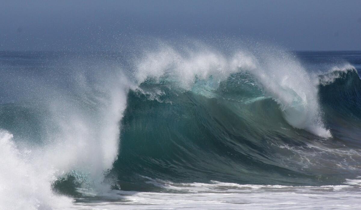 A big wave breaks at Westward Beach in Malibu, Calif.