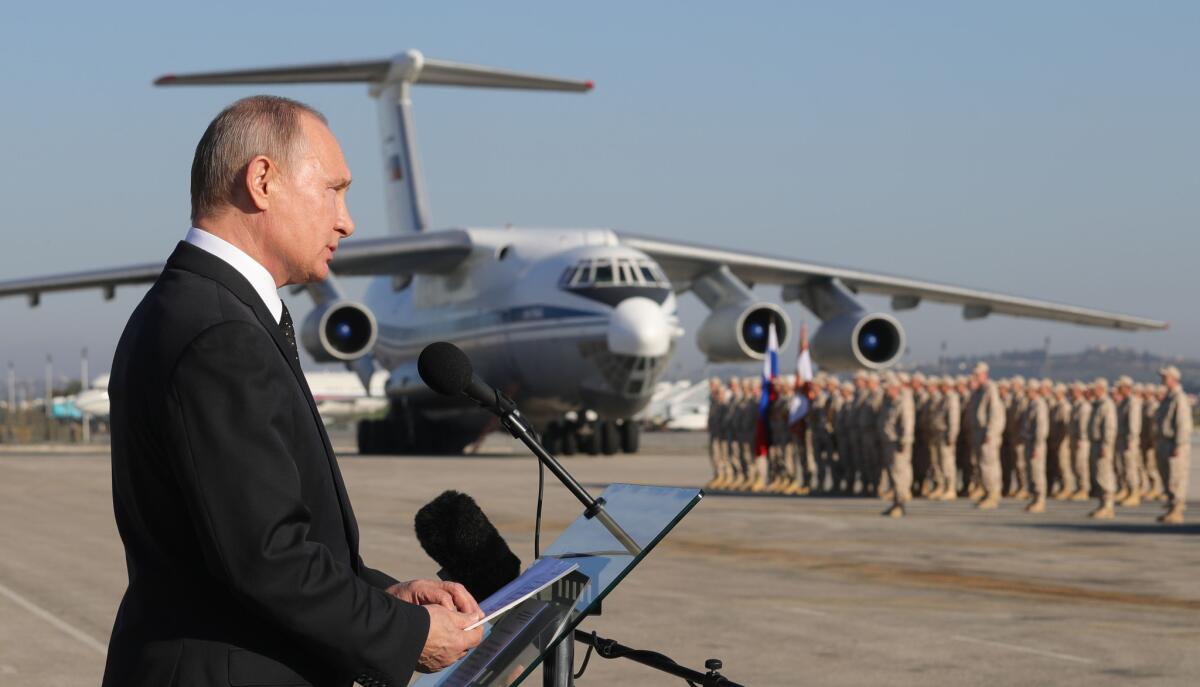 Russian President Vladimir Putin addresses troops at the Hemeimeem air base in Syria on Dec. 11, 2017.