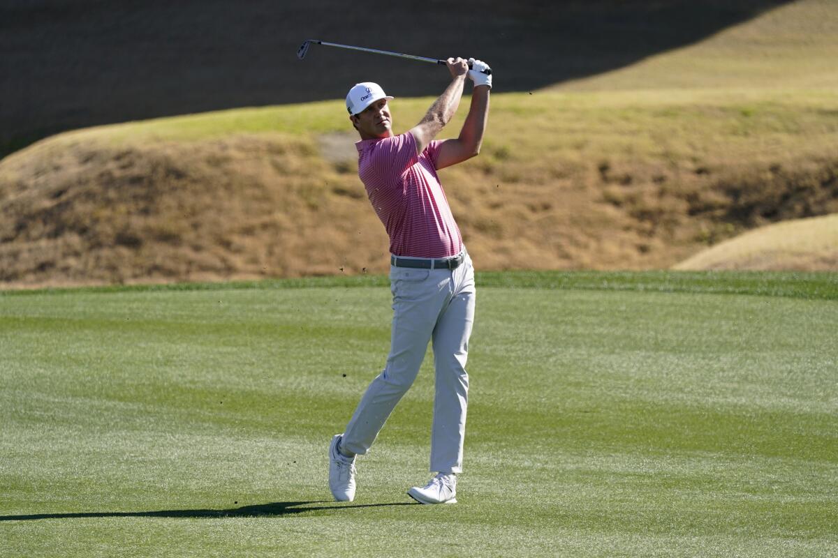 Hudson Swafford hits from the third fairway during the final round of the American Express golf tournament on the Pete Dye Stadium Course at PGA West, Sunday, Jan. 23, 2022, in La Quinta, Calif. (AP Photo/Marcio Jose Sanchez)