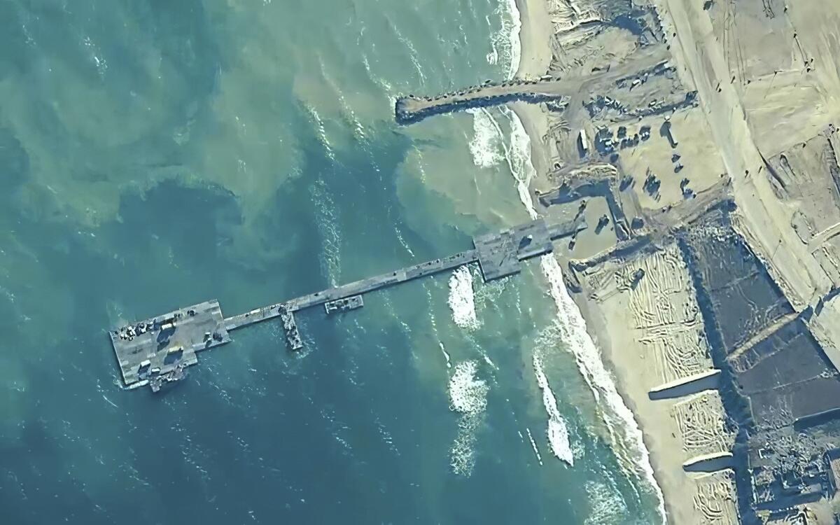 A high-altitude view of a floating pier, left, connected to the Gaza shore. 