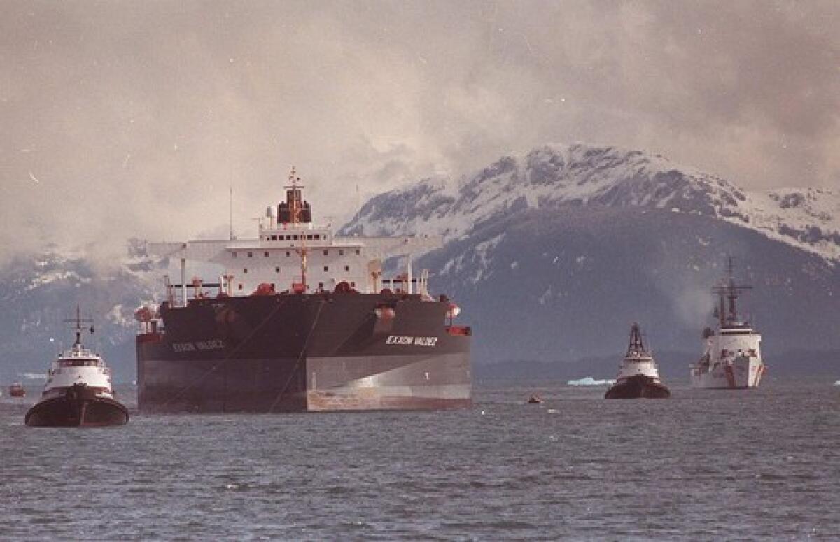 The Exxon Valdez is towed out of Prince William Sound in Alaska in June 1989, three months after it hit a reef and spilled 11 million gallons of crude oil.