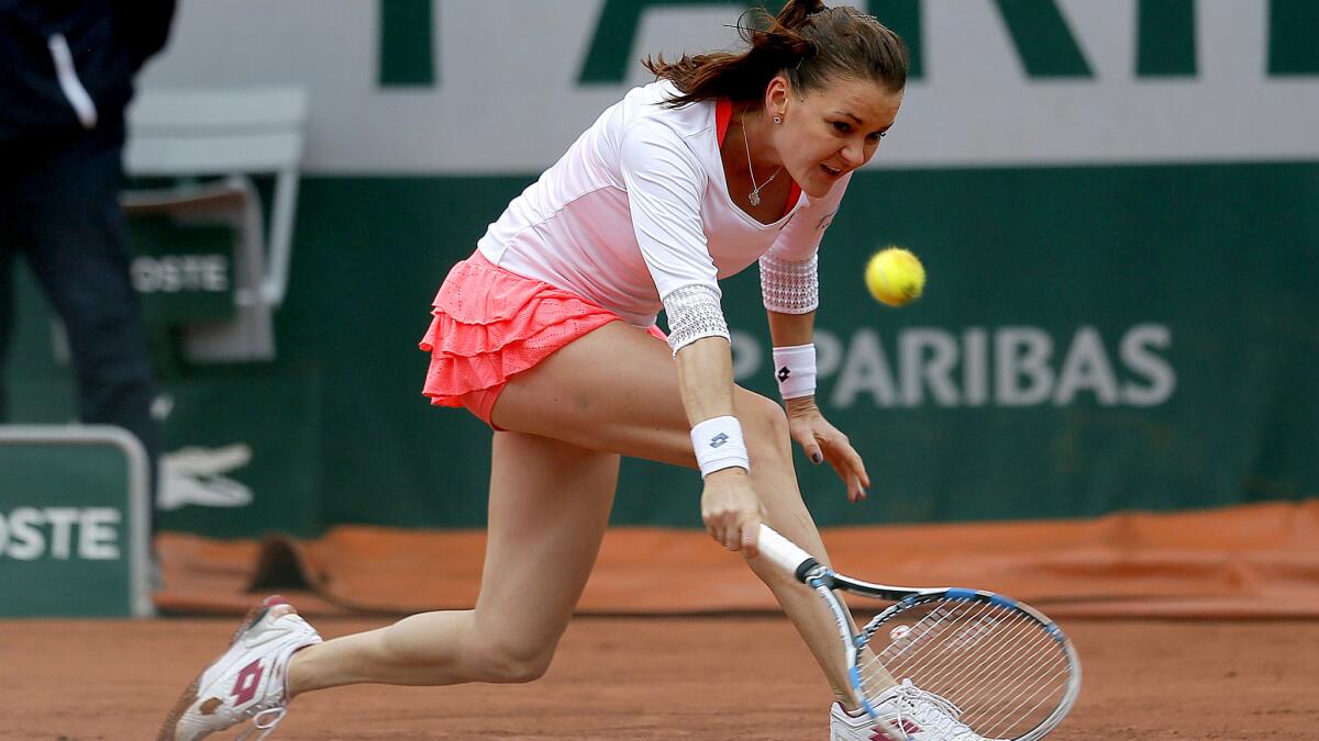 Agnieszka Radwanska chases down a shot against Tsvetana Pironkova during their French Open match on Tuesday.