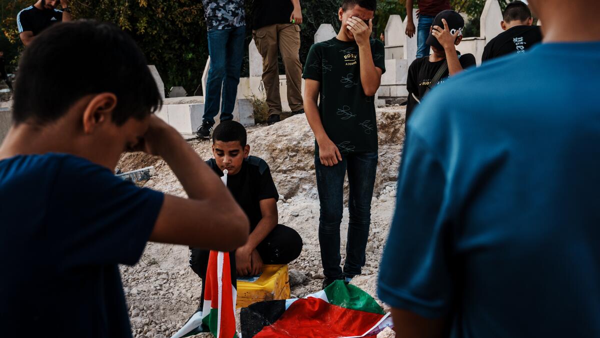 A stone, a bullet, a burial. A Palestinian boy's death in the West Bank signals wider unrest 