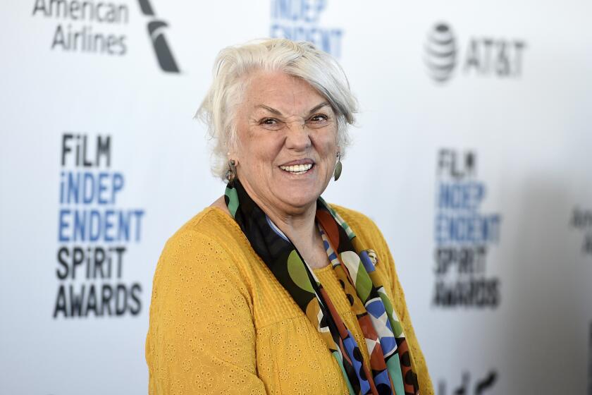 Tyne Daly in yellow blouse and multicolor scarf at Film Independent Spirit Awards carpet