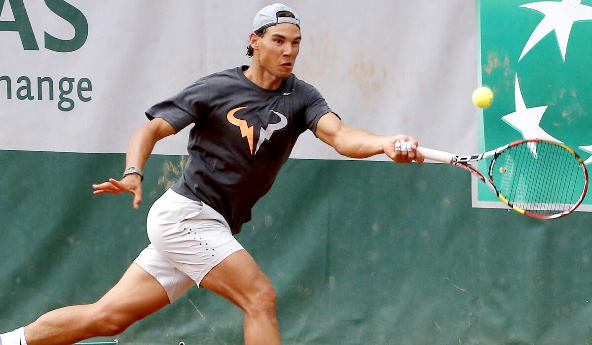 Rafael Nadal tracks down a shot during a training session for the French Open.