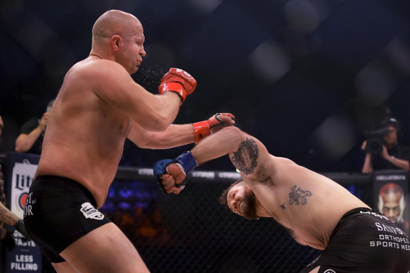 Ryan Bader, right, knocks out Fedora Emelianenko during their mixed martial arts heavyweight world title bout at Bellator 214 on Saturday, Jan. 26, 2019, in Inglewood, Calif. (AP Photo/Chris Carlson)