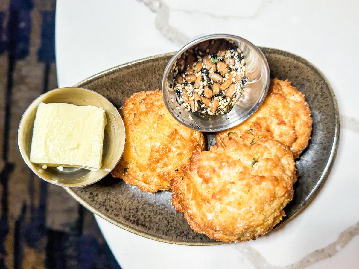 A starter of cornmeal-cheddar drop biscuits at Alice B. in Palm Springs.