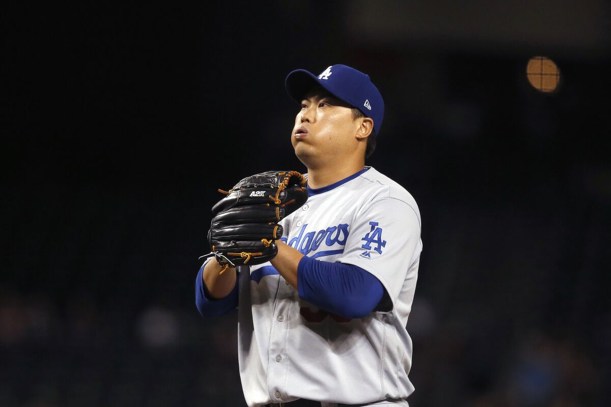 Dodgers starting pitcher Hyun-Jin Ryu pauses on the mound during the first inning of a loss to the Arizona Diamondbacks on Thursday.