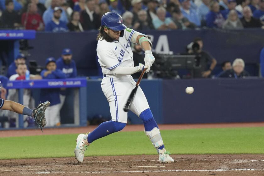 Toronto Blue Jays' Bo Bichette hits an RBI double against the Tampa Bay Rays during seventh inning of a baseball game Friday, Sept. 29, 2023, in Toronto. (Chris Young/The Canadian Press via AP)