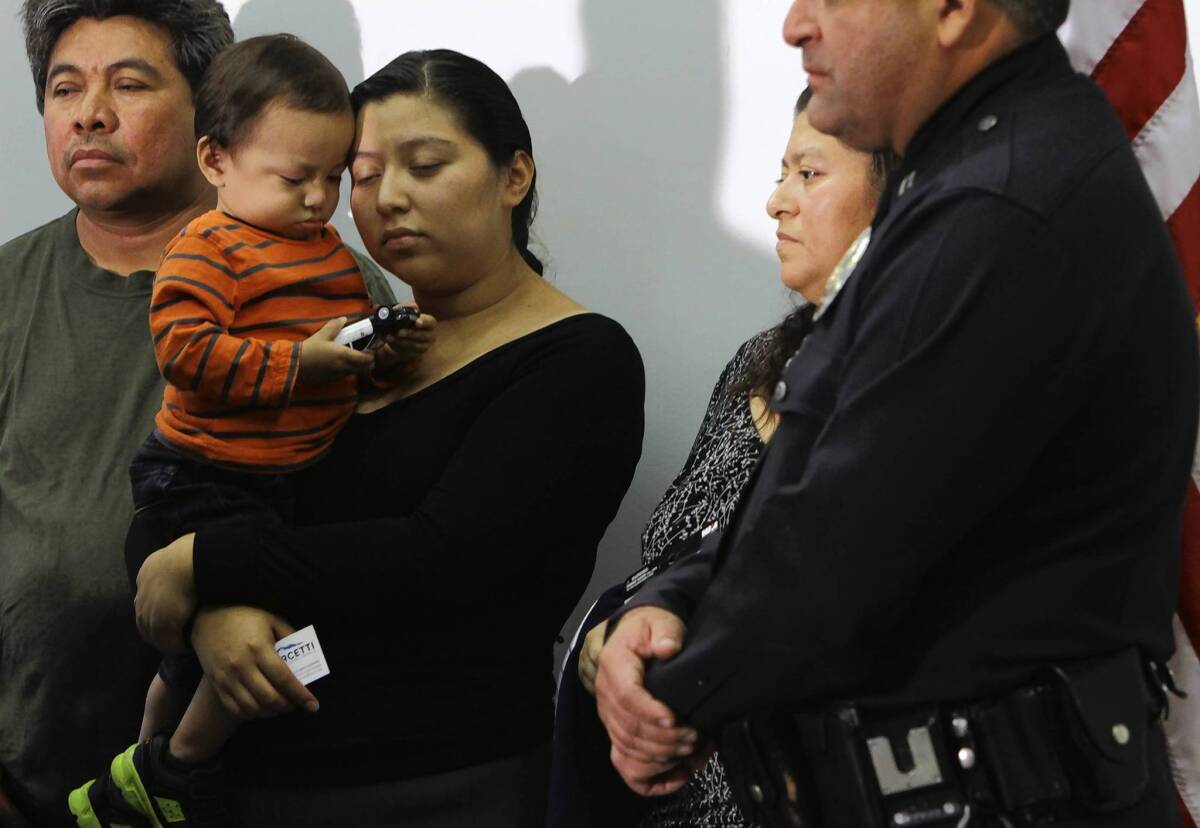 The family of slain Andres Ordonez -- left to right, his father-in-law Cirilo Mendez, his son Nehemias Andres Ordonez, his wife Ana Mendez and the boy's grandmother, Ana Mendez -- attend a news conference at LAPD's Rampart Station. At right is LAPD Capt. Steven Ruiz.