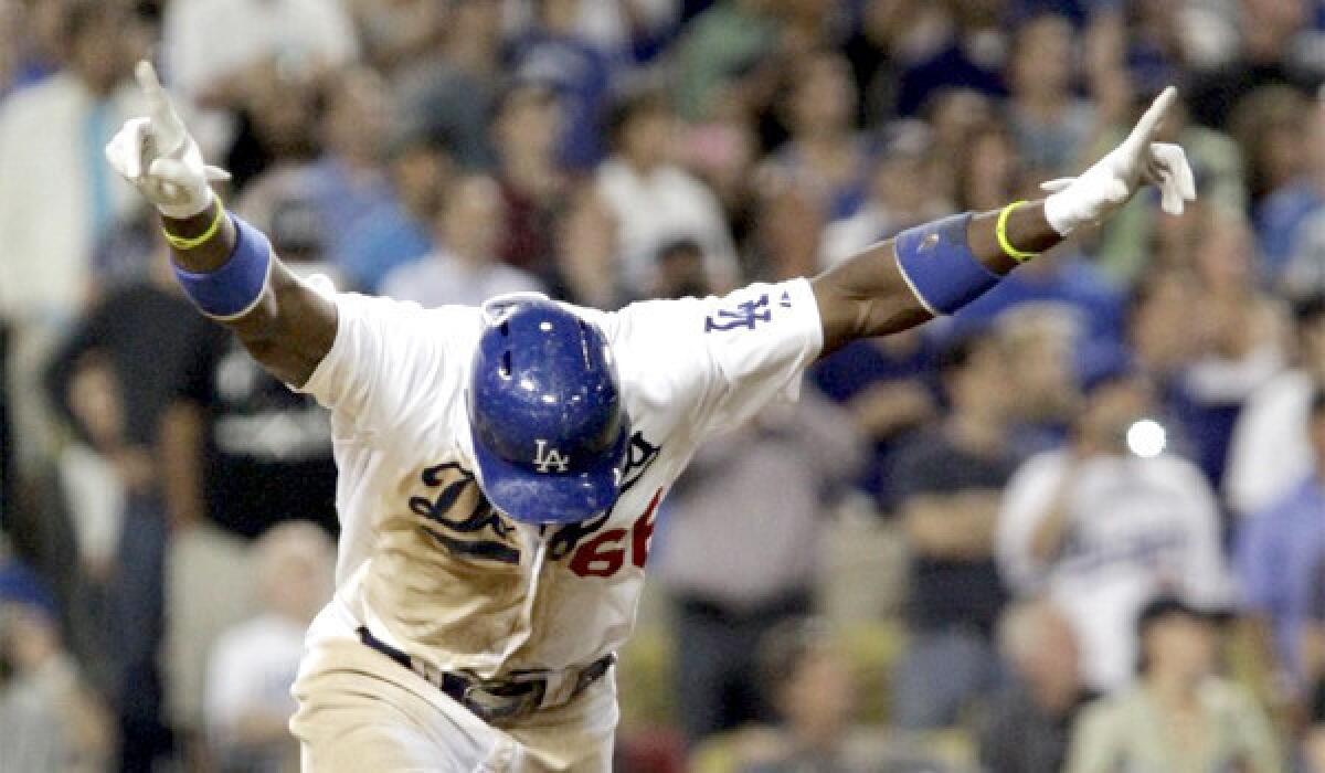 Yasiel Puig celebrates after hitting a two-run RBI single to give the Dodgers the lead and eventually a 6-4 win over the Philadelphia Phillies.