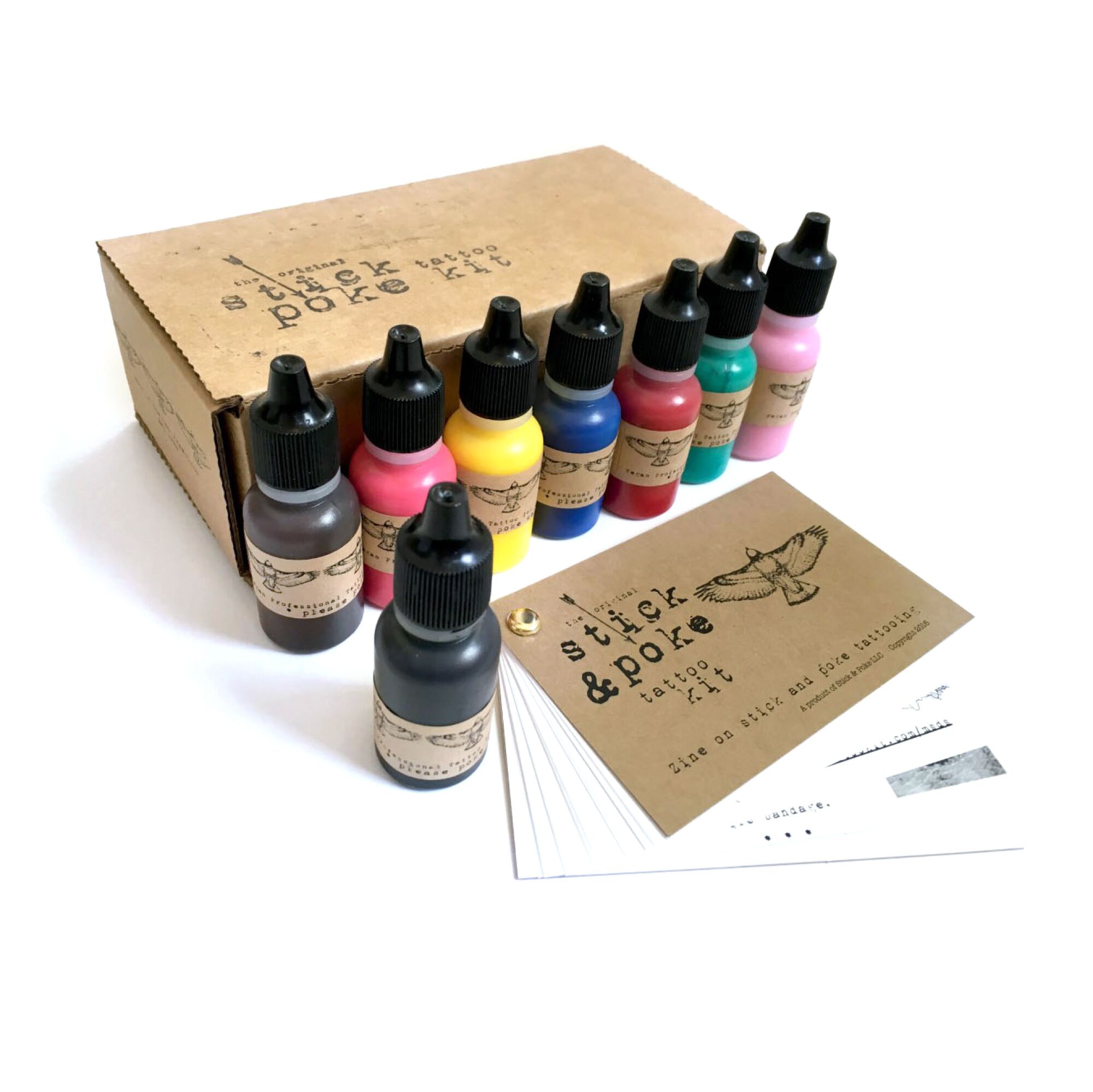 A lineup of bottled colors in a Stick & Poke self-tattoo set.