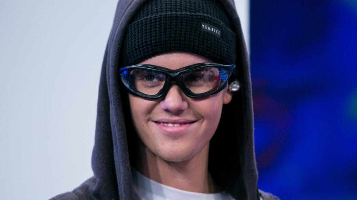 Justin Bieber, shown recently on a TV show in Spain, no longer has to meet with his probation officer regarding his egging of a neighbor's house in January 2014.