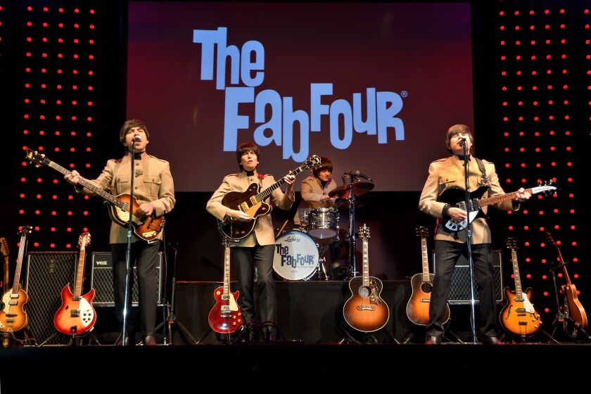 Beatles tribute band The Fab Four plays at the Lawrence Family Jewish Community Center Patron Party.
