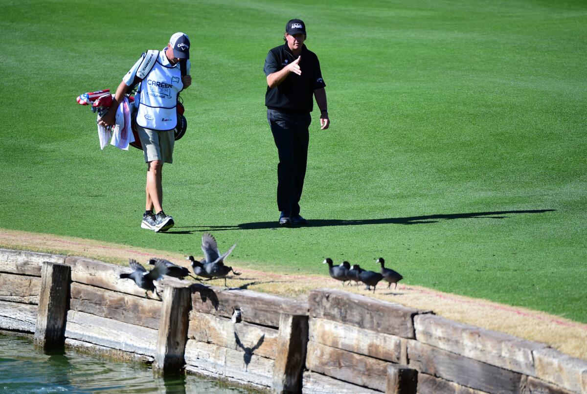 Phil Mickelson walks down the fifth fairway during the final round of the CareerBuilder Challenge on Jan. 24.