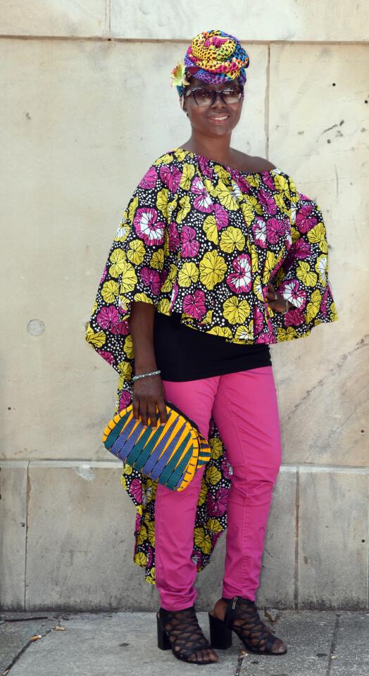 Who: Akos Regal, “over 50-ish,” Canton resident, Regal Clothes designer Spotted at: For the Culture: Africana Pop-Up event at Tightfisted Fashion: Resale & Consignment Store What she wore: Pink, yellow, black and white print cotton cape top, multicolor print headpiece and yellow, green and blue crossbody clutch bag all from her own line; pink skinny jeans from Tightfisted Fashion; Bamboo black cage sandals from DSW; black camisole from Target; and crystal stud earrings and silk flower in her hair were flea market finds. Her self-described style: “Chic Africana. I always like whimsical designs. Color soothes my soul.”