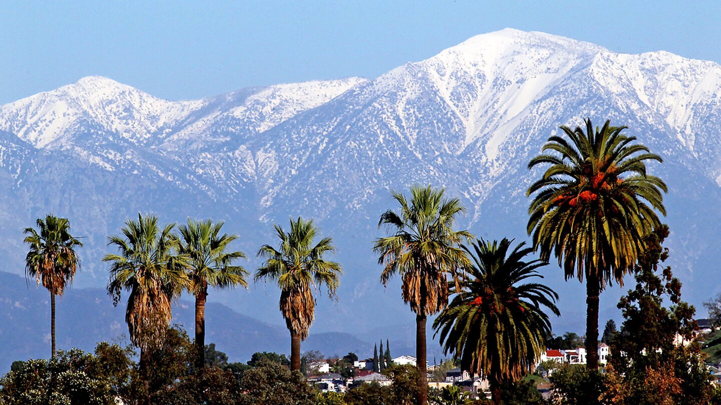 Snow-covered San Gabriel mountains are seen from Boyle Heights in December 2012.