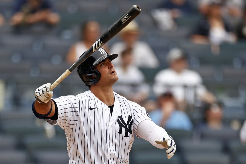 New York Yankees' Mike Ford watches his solo home run during the fifth inning of a baseball game against the Chicago White Sox on Saturday, May 22, 2021, in New York. (AP Photo/Adam Hunger)