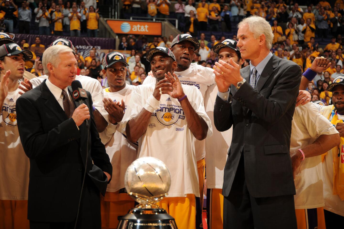 Jerry West speaks to Lakers general manager Mitch Kupchak after the team clinched the 2008 Western Conference title.