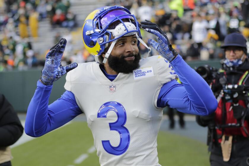 Los Angeles Rams' Odell Beckham Jr. takes the field to warm up before an NFL football game.