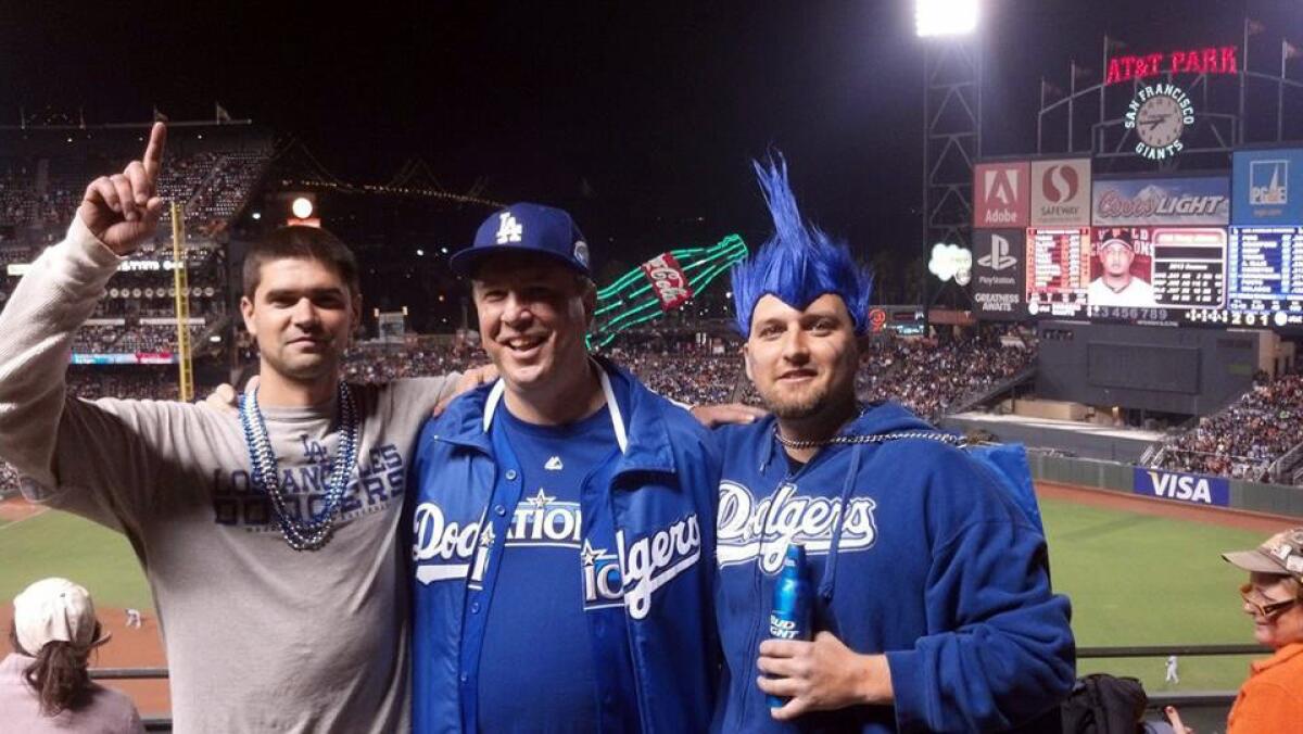 Jonathan Denver, left, with his father, Robert Preece, and brother, Rob Preece, at the Dodgers game in San Francisco on the night of his stabbing death.