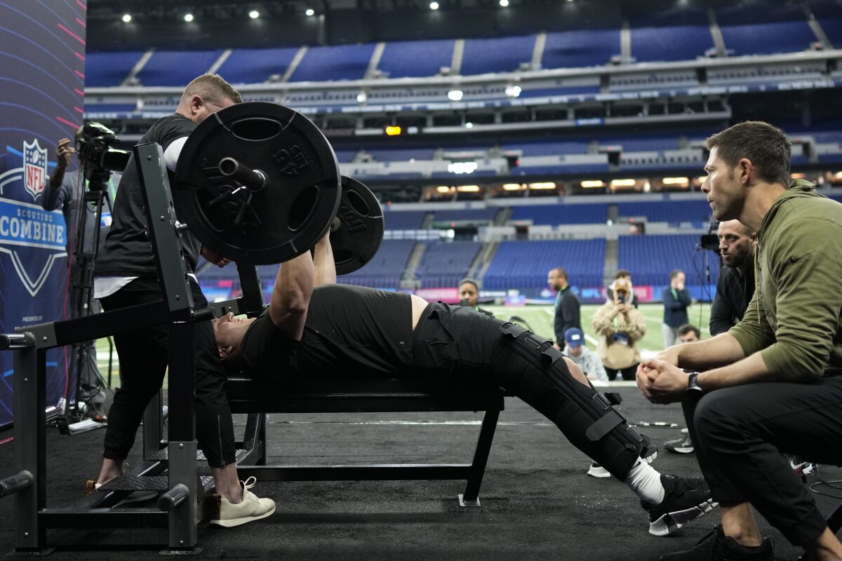 USC offensive lineman Andrew Vorhees participates in the bench press at the NFL combine.
