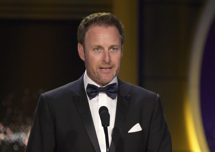 FILE - In this April 29, 2018, file photo, Chris Harrison presents the award for outstanding entertainment talk show host at the Daytime Emmy Awards at the Pasadena Civic Center in Pasadena, Calif. Harrison is stepping aside as host of "The Bachelor" franchise. (Photo by Richard Shotwell/Invision/AP, File)
