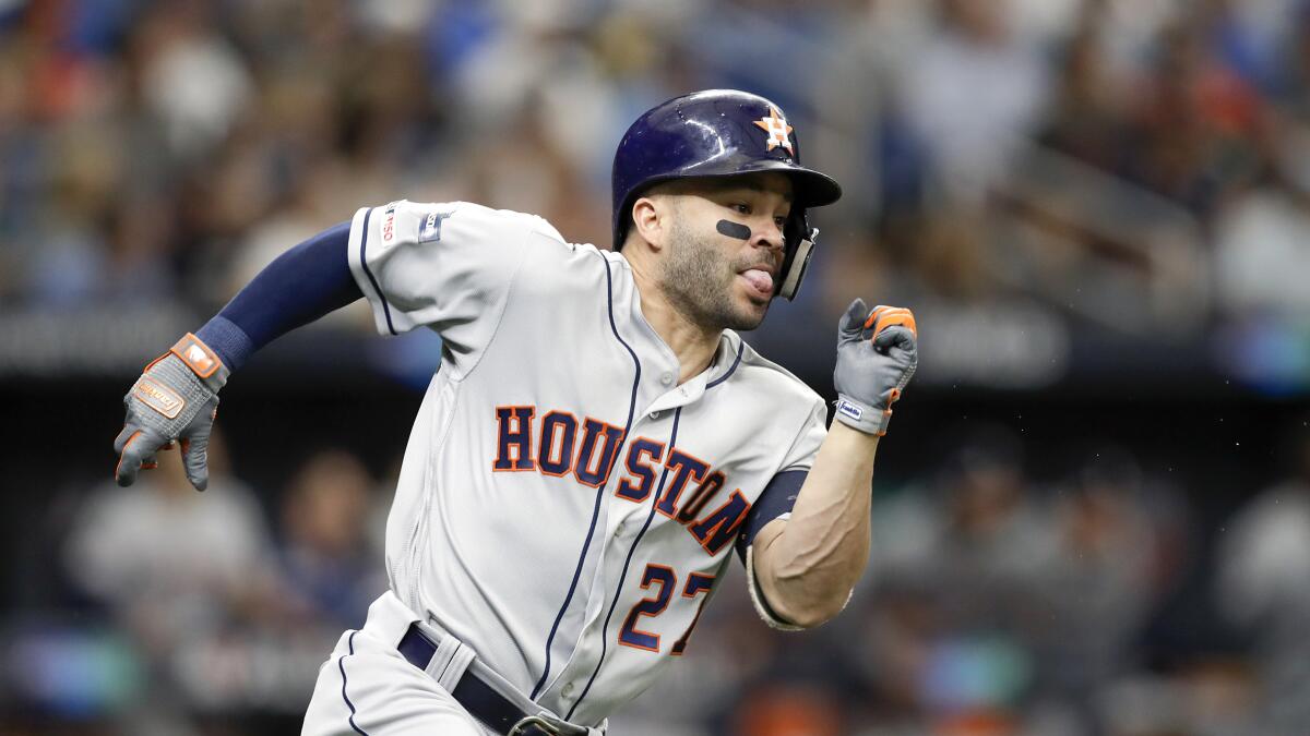 Houston Astros' Jose Altuve runs after hitting double against the Tampa Bay Rays during Game 3 of a baseball American League Division Series, Monday, Oct. 7, 2019, in St. Petersburg, Fla. (AP Photo/Chris O'Meara)